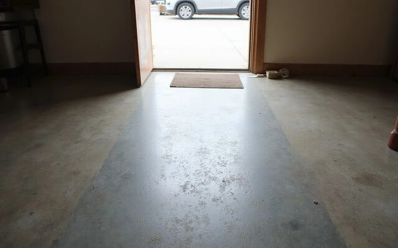 Traffic-lane dulling visible across a polished concrete floor